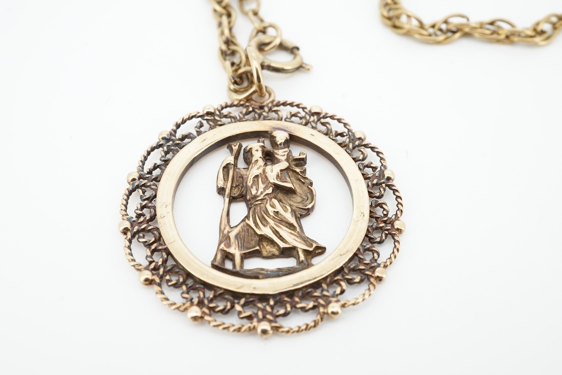 A modern 9ct gold Star of David pendant, diameter 22mm, a 9ct gold St Christopher's pendant on a 9ct chain and an Italian Uno-A-Erre 9k Mercedes insignia keyring, gross weight 22.2 grams.